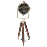 An adjustable tripod spotlight with a wooden stand and aluminum body, featuring a spotlight lens at the top.